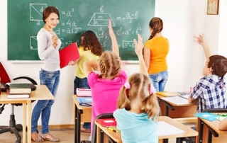 School child with teacher in classroom.